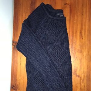 This is a soft, knit navy blue sweater!